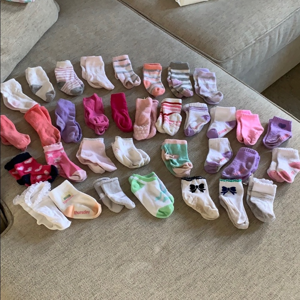 34 pairs of baby girl socks newborn to 12-24 mo